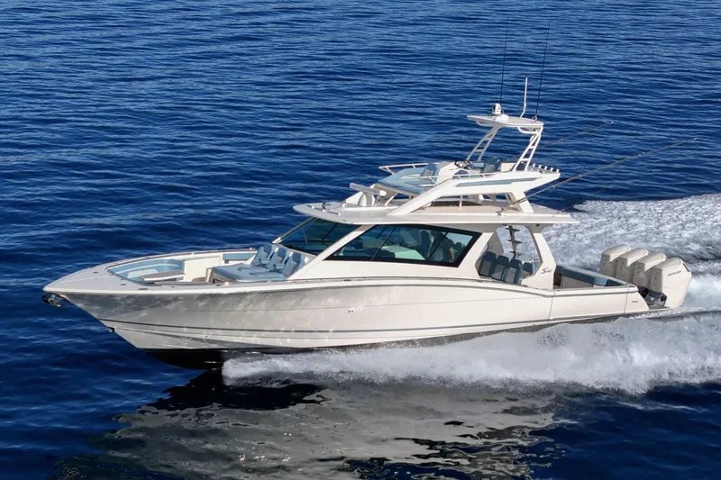 The Image of 2023 Scout 530 LXF luxury yacht cruising on open blue water. - 0