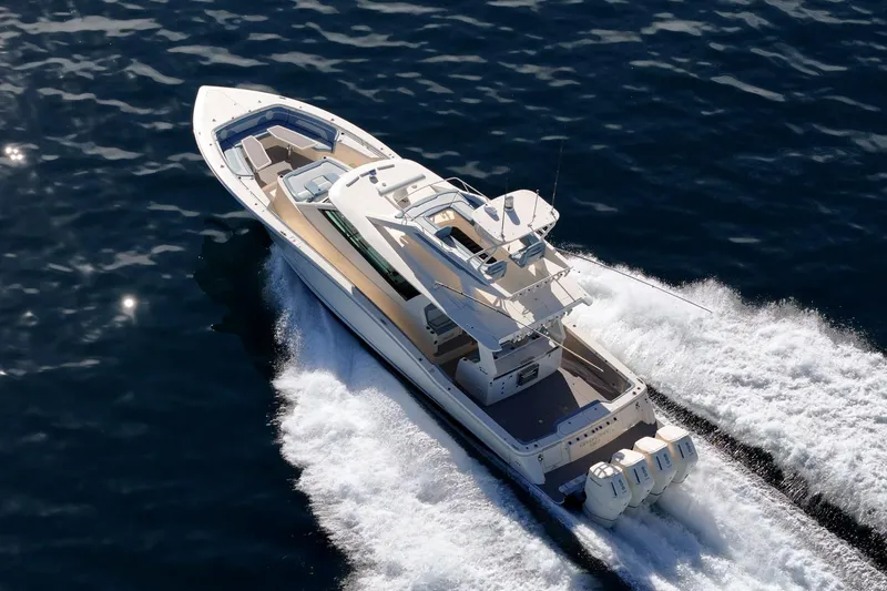 Slide: The Image of 2023 Scout 530 LXF luxury yacht cruising on open water. - 12