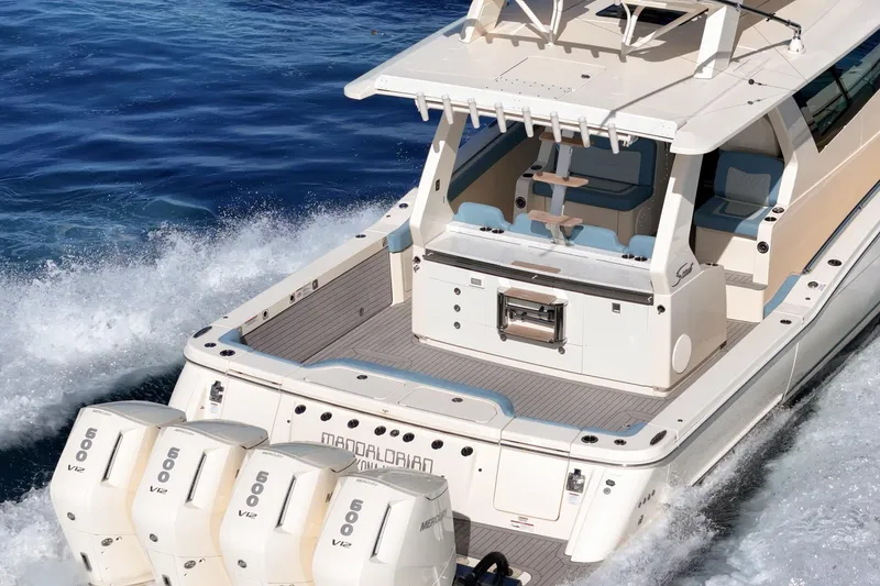 Slide: The Image of 2023 Scout 530 LXF luxury boat with powerful engines cruising on the ocean. - 17