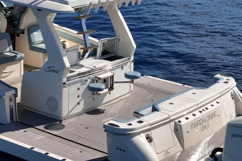 Slide: The Image of 2023 Scout 530 LXF luxury boat deck with seating and ocean view. - 21