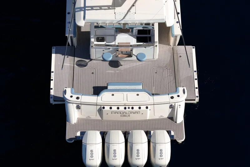 Slide: The Image of 2023 Scout 530 LXF luxury boat with four powerful engines, aerial view. - 22