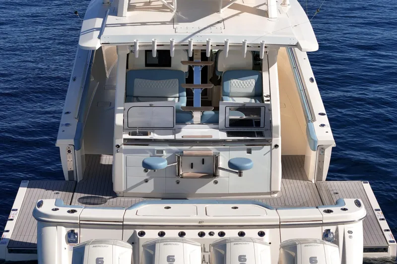 Slide: The Image of 2023 Scout 530 LXF luxury yacht with spacious deck and modern amenities on the water. - 23