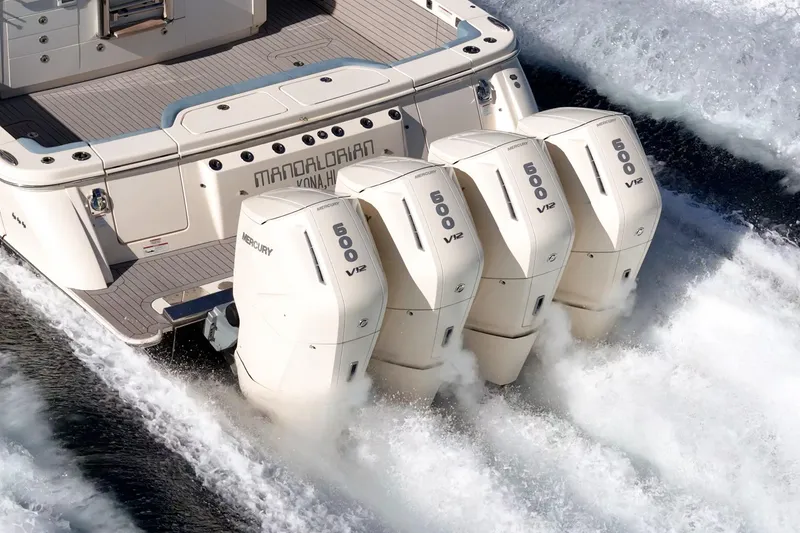 Slide: The Image of 2023 Scout 530 LXF with four Mercury 600 V12 engines cruising on water. - 27