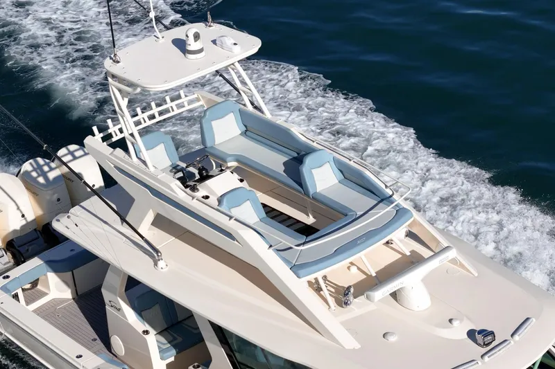 Slide: The Image of 2023 Scout 530 LXF luxury boat cruising on open water. - 28