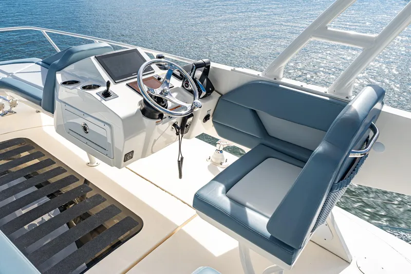 Slide: The Image of 2023 Scout 530 LXF boat helm with modern controls and luxurious seating. - 32