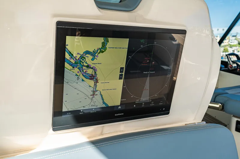 Slide: The Image of 2023 Scout 530 LXF boat with Garmin navigation display showing nautical map and radar. - 54