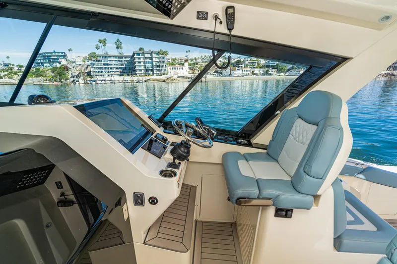 Slide: The Image of 2023 Scout 530 LXF helm with luxurious seating and advanced navigation system. - 55