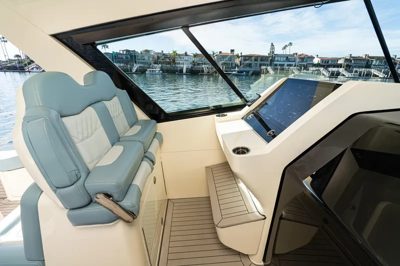 Slide: The Image of Luxurious interior of 2023 Scout 530 LXF yacht with plush seating and modern dashboard. - 63
