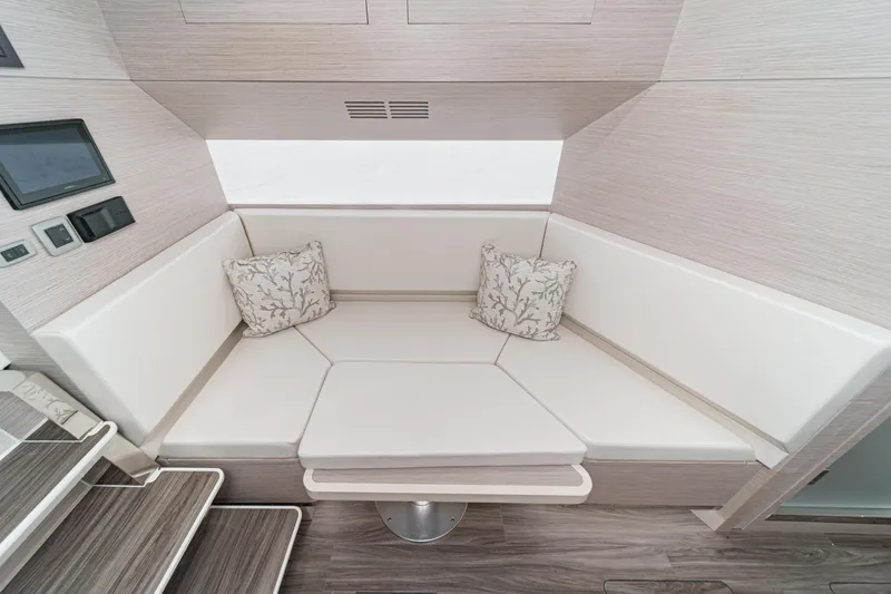Slide: The Image of Luxurious interior seating area of 2023 Scout 530 LXF boat with cushions. - 69