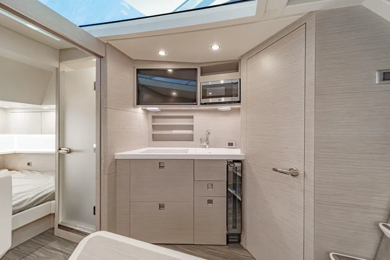 Slide: The Image of Luxurious interior of 2023 Scout 530 LXF yacht with modern kitchenette and sleek design. - 70