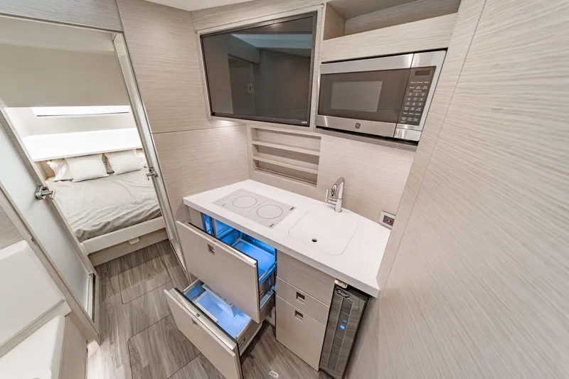 Slide: The Image of Modern kitchen interior of 2023 Scout 530 LXF yacht with sleek appliances and cabinetry. - 71