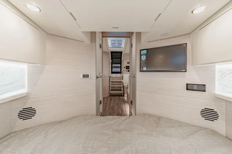 Slide: The Image of 2023 Scout 530 LXF interior cabin with modern design, TV, and ambient lighting. - 73