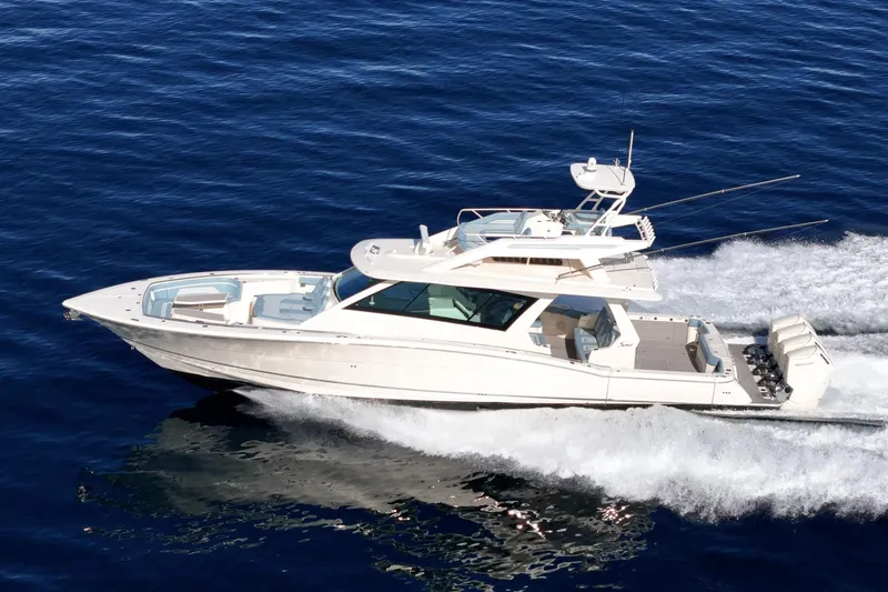 Slide: The Image of 2023 Scout 530 LXF luxury yacht cruising on open water. - 9