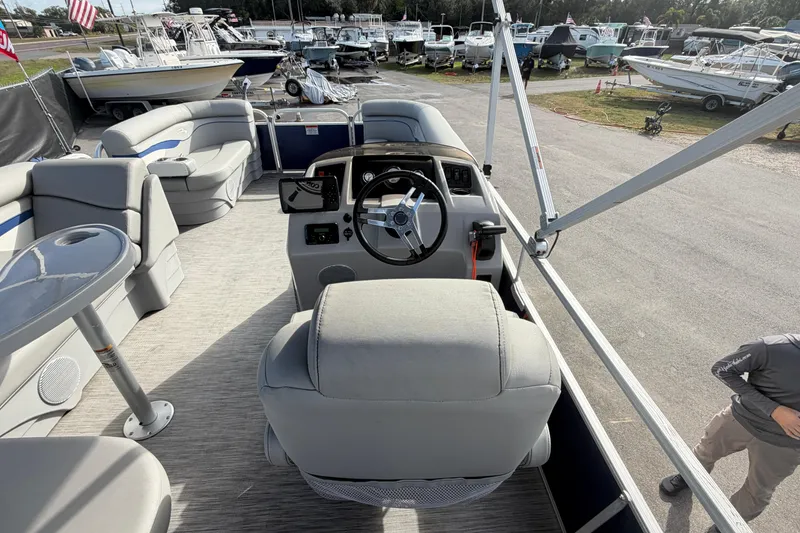 Slide: The Image of 2021 Bennington 20 SV pontoon boat interior with helm, seating, and table. - 22