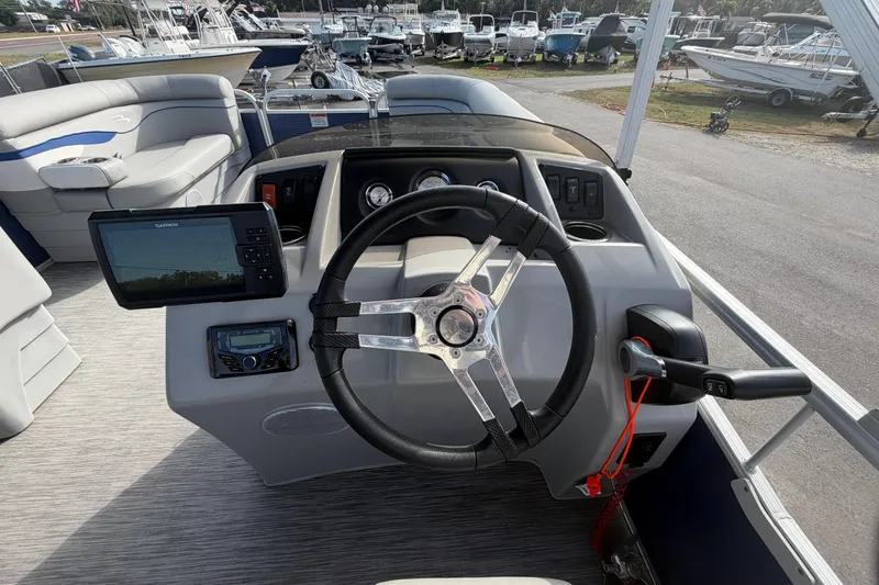 Slide: The Image of 2021 Bennington 20 SV boat dashboard with steering wheel and navigation system. - 23