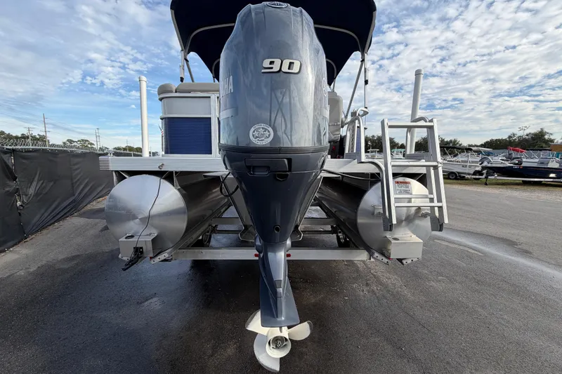 Slide: The Image of 2021 Bennington 20 SV pontoon boat with Yamaha 90 engine, parked outdoors. - 3