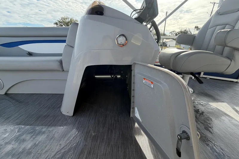 Slide: The Image of 2021 Bennington 20 SV boat interior with open storage compartment and seating. - 30