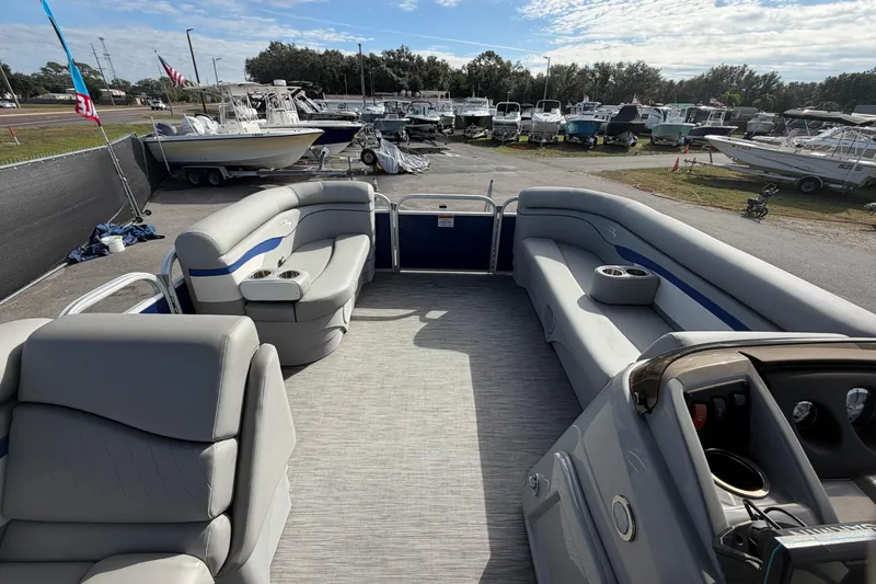 Slide: The Image of 2021 Bennington 20 SV pontoon boat interior with gray seating and cup holders. - 32