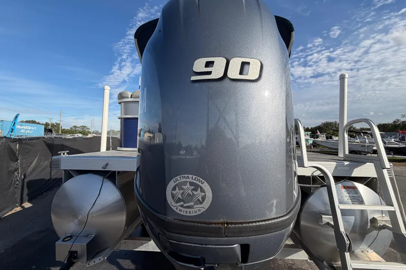 Slide: The Image of 2021 Bennington 20 SV boat with 90 HP engine, ultra-low emission, under clear blue sky. - 4