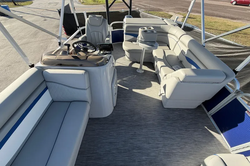Slide: The Image of 2021 Bennington 20 SV pontoon boat interior with plush seating and steering console. - 40