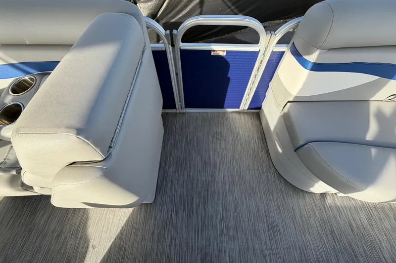 Slide: The Image of 2021 Bennington 20 SV pontoon boat interior with gray seating and cup holders. - 41