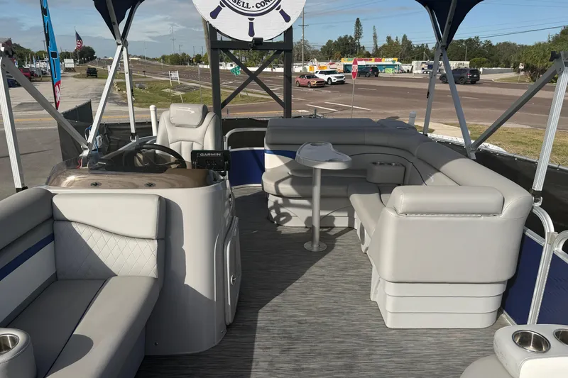 Slide: The Image of 2021 Bennington 20 SV pontoon boat interior with plush seating and steering console. - 42