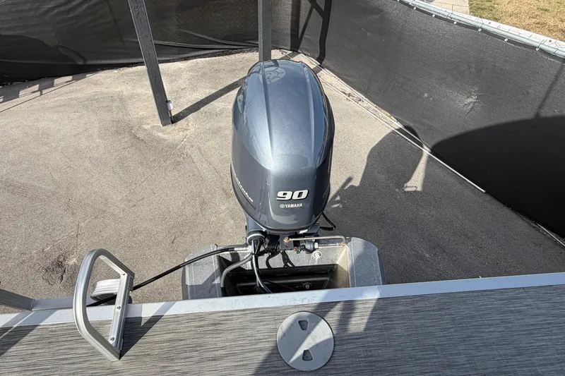 Slide: The Image of 2021 Bennington 20 SV boat with Yamaha 90 outboard motor, docked on concrete surface. - 47