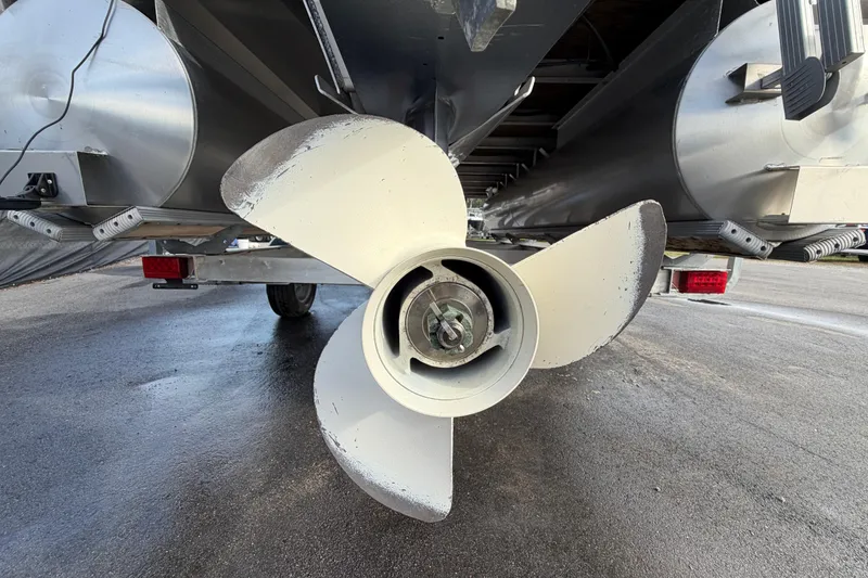 Slide: The Image of 2021 Bennington 20 SV pontoon boat propeller and pontoons on a trailer. - 5