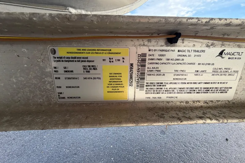 Slide: The Image of 2021 Bennington 20 SV trailer label with tire and loading information, Magic Tilt Trailers. - 55