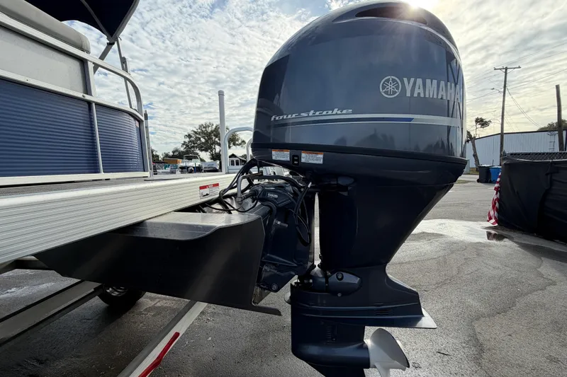 Slide: The Image of 2021 Bennington 20 SV pontoon boat with Yamaha four-stroke outboard motor. - 6