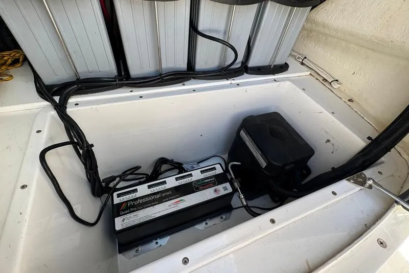Slide: The Image of Battery compartment of 2021 BlackJack 256 Coastal boat with wiring and equipment. - 15