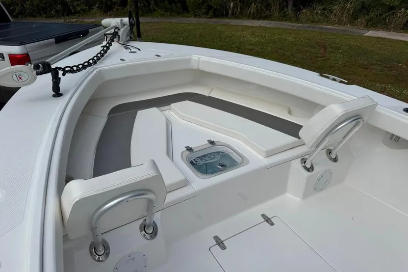 Slide: The Image of 2021 BlackJack 256 Coastal boat interior with seating and storage compartments. - 38