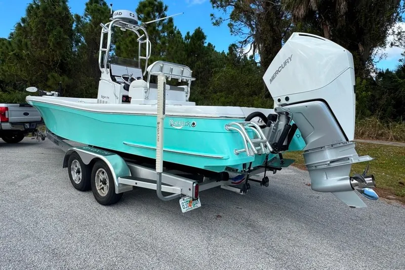 Slide: The Image of 2021 BlackJack 256 Coastal boat on trailer with Mercury outboard engine. - 8