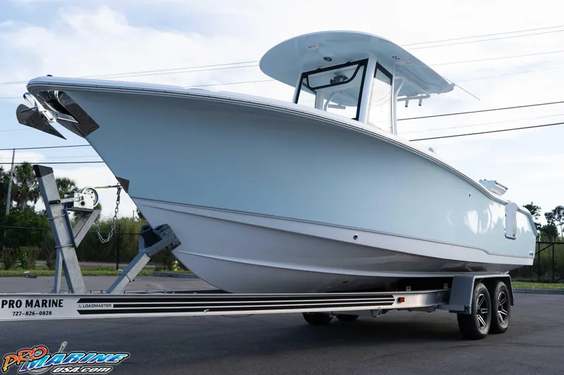 Slide: The Image of 2026 Sea Hunt Ultra 265 SE boat on trailer, side view. - 11