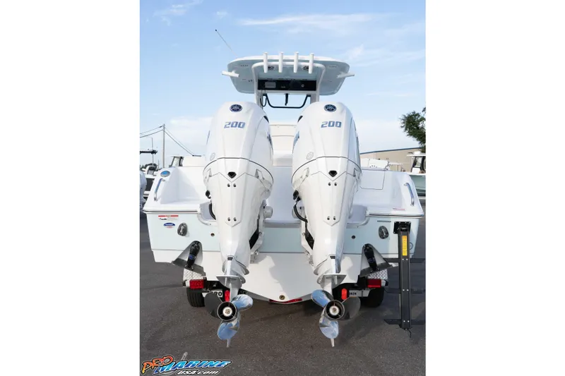 Slide: The Image of 2026 Sea Hunt Ultra 265 SE with dual 200 horsepower engines, rear view. - 16