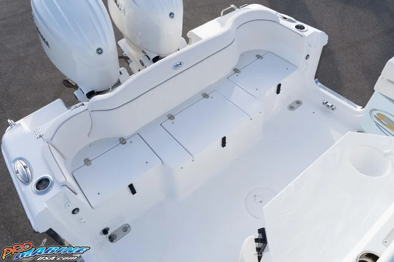 Slide: The Image of 2026 Sea Hunt Ultra 265 SE boat deck with dual Yamaha engines, spacious seating, and storage compartments. - 19