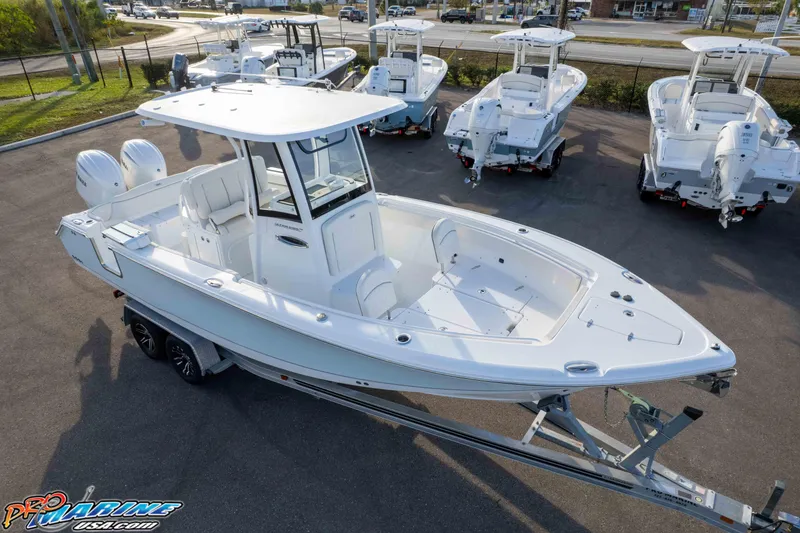 Slide: The Image of 2026 Sea Hunt Ultra 265 SE boat on trailer in dealership lot. - 24