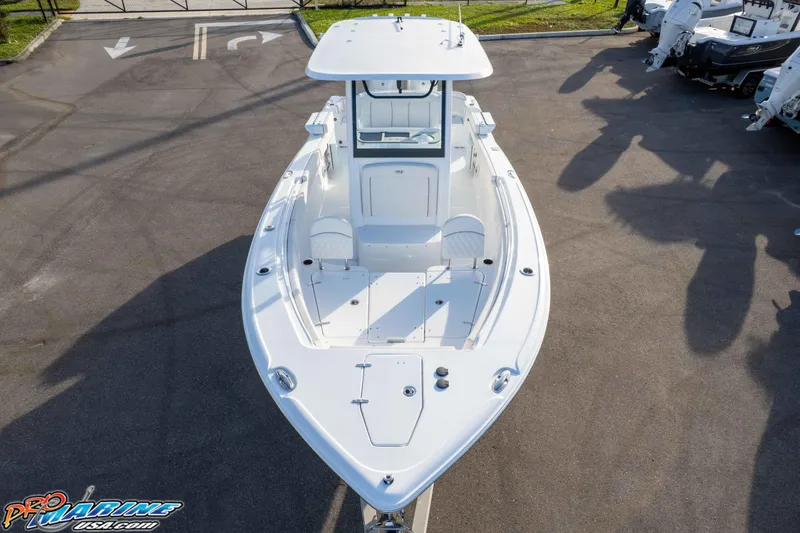 Slide: The Image of 2026 Sea Hunt Ultra 265 SE boat, aerial view, parked on pavement. - 29