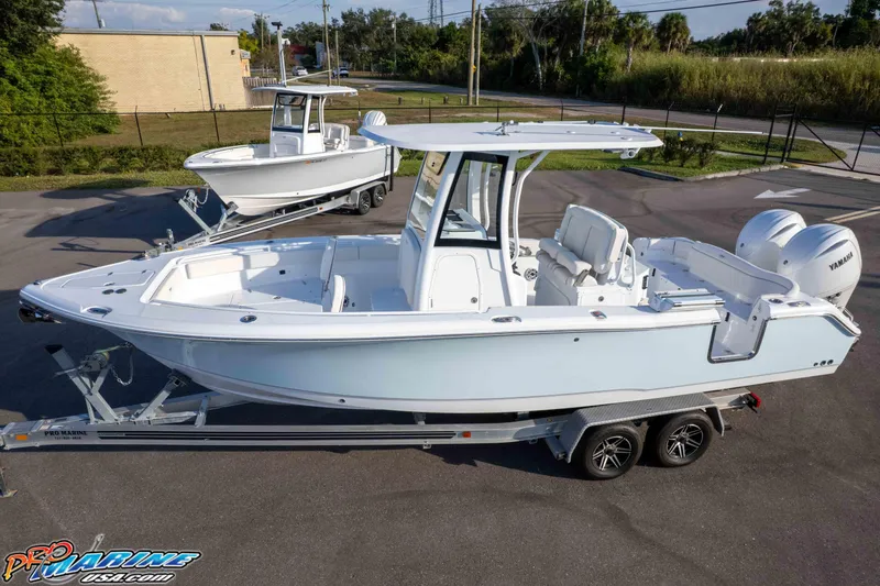 Slide: The Image of 2026 Sea Hunt Ultra 265 SE boat on trailer, featuring dual Yamaha engines. - 3