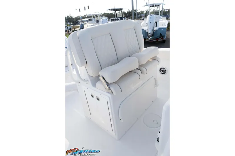 Slide: The Image of 2026 Sea Hunt Ultra 265 SE boat seating, featuring white cushioned helm seats. - 30