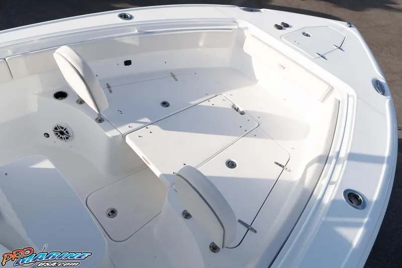 Slide: The Image of 2026 Sea Hunt Ultra 265 SE boat interior with seating and storage compartments. - 32