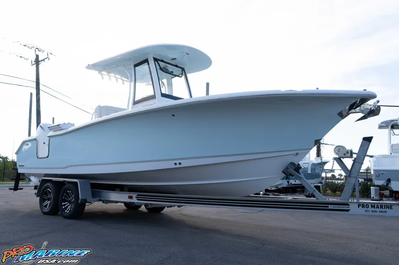 Slide: The Image of 2026 Sea Hunt Ultra 265 SE boat on trailer at Pro Marine dealership. - 5