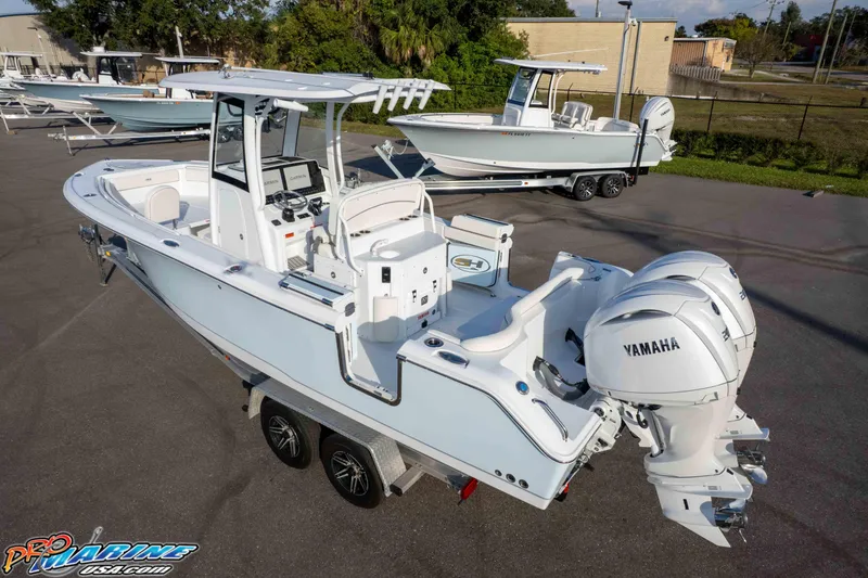 Slide: The Image of 2026 Sea Hunt Ultra 265 SE boat with dual Yamaha engines on a trailer. - 6