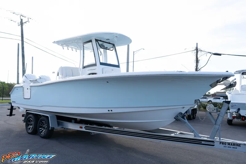 Slide: The Image of 2026 Sea Hunt Ultra 265 SE boat on trailer at Pro Marine dealership. - 7