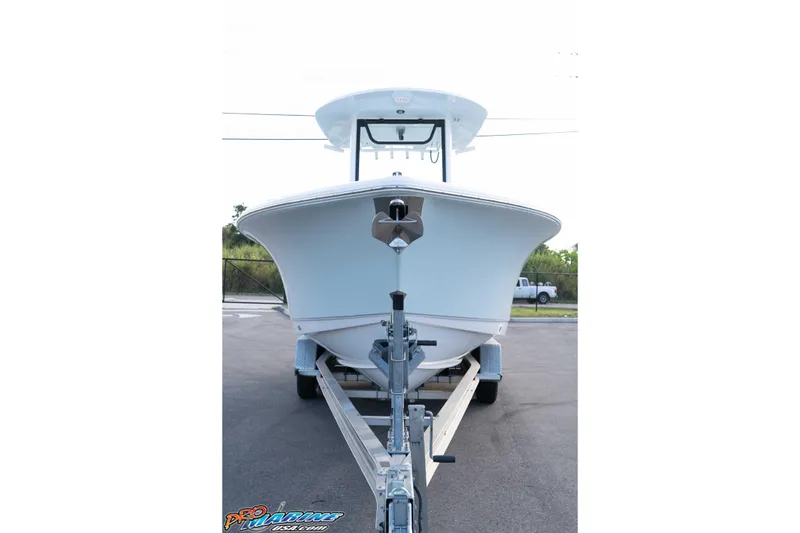 Slide: The Image of 2026 Sea Hunt Ultra 265 SE boat on trailer, front view. - 9