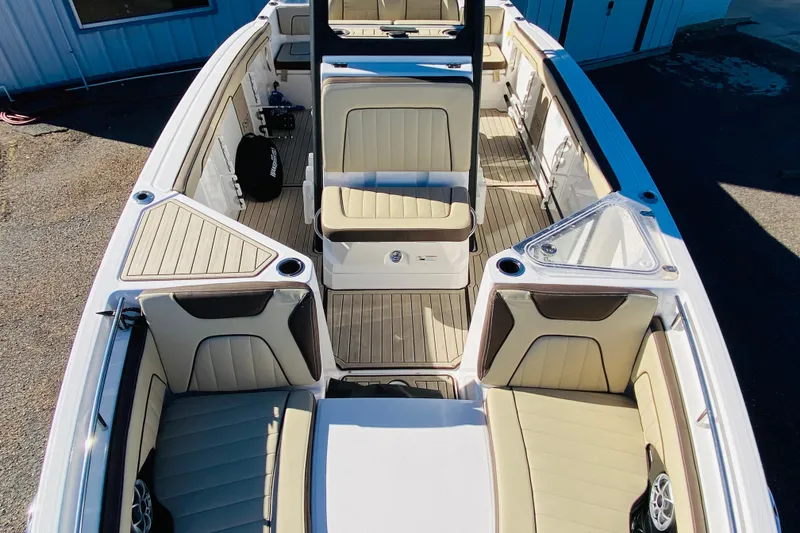 Slide: The Image of 2023 Yamaha Boats 255 FSH Sport E interior with beige seating and modern design. - 6