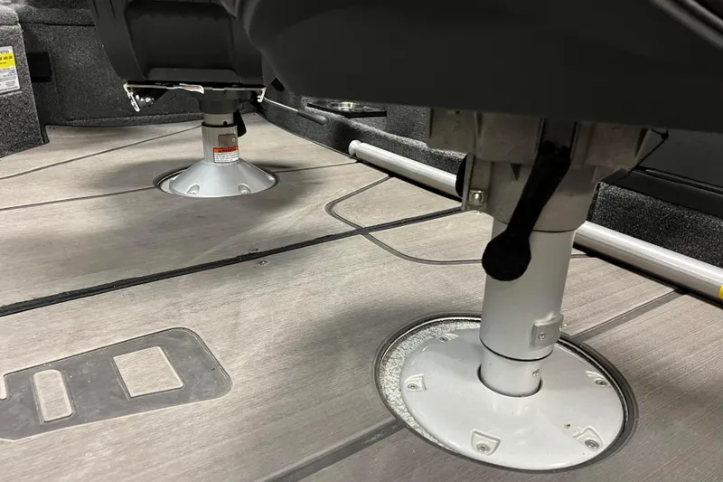 Slide: The Image of 2023 Lund 2175 Pro-V boat interior with pedestal seats and non-slip flooring. - 27