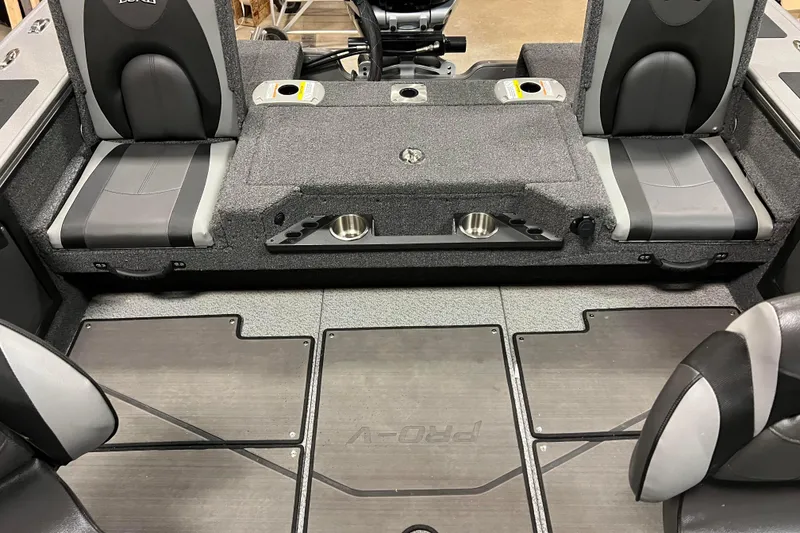 Slide: The Image of 2023 Lund 2175 Pro-V boat interior with seating and storage compartments. - 32