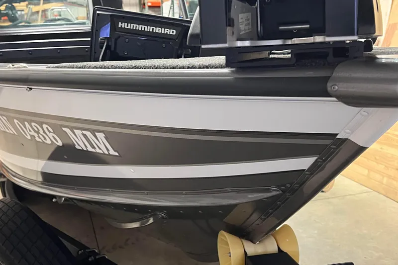Slide: The Image of 2023 Lund 2175 Pro-V boat with Humminbird electronics, parked on a trailer. - 51