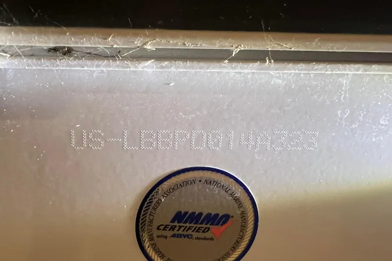 Slide: The Image of 2023 Lund 2175 Pro-V boat with NMMA certification label and serial number. - 64